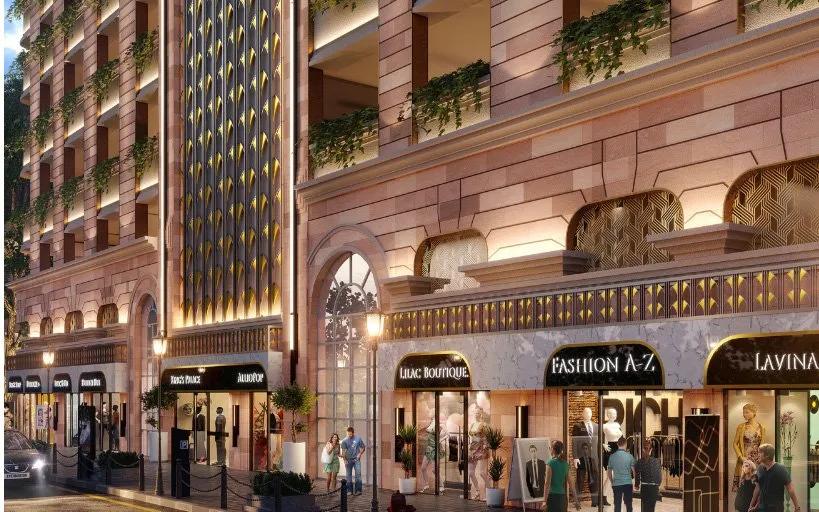 Render of the tower's Art Deco street front at dusk, with a gilded jaali above lit shopfronts