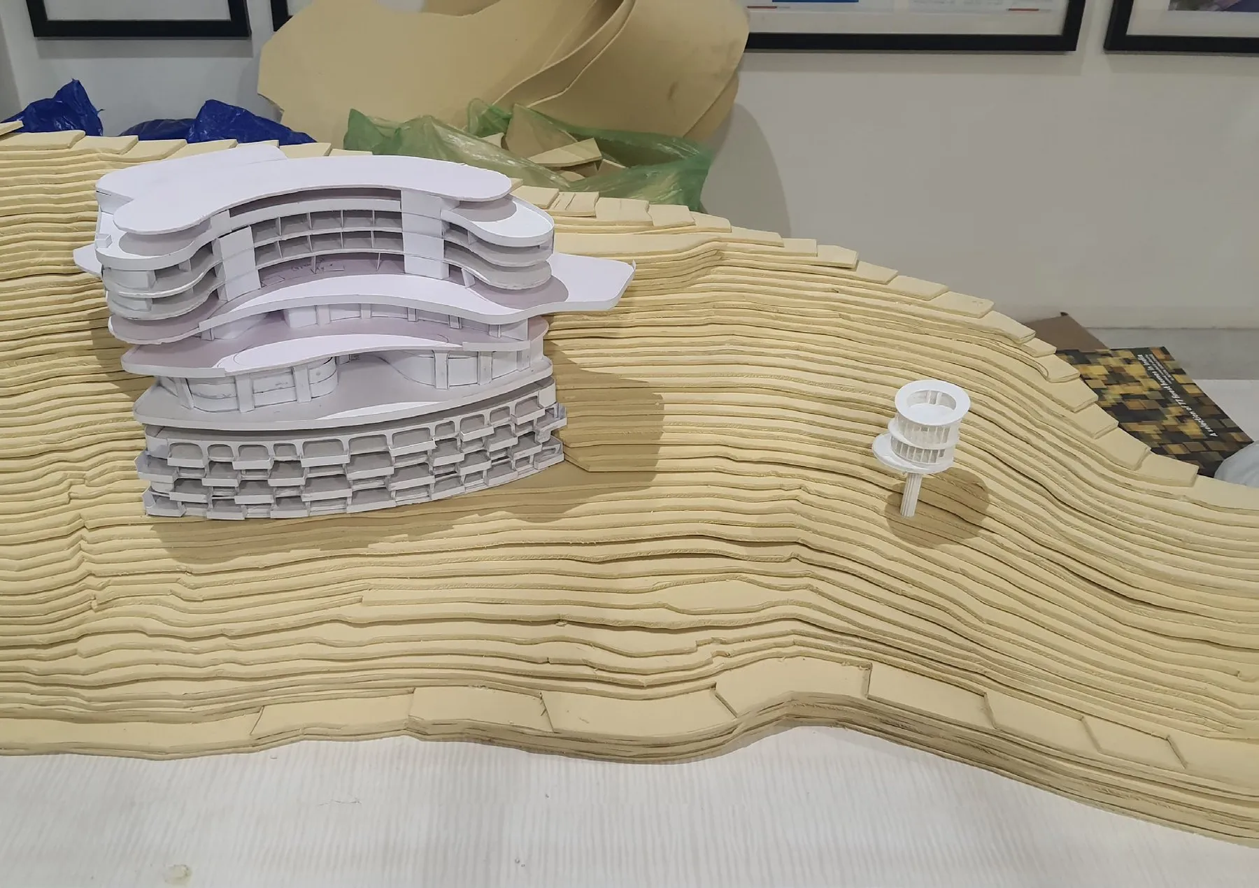 The 3D-printed white hotel block placed on the card contours